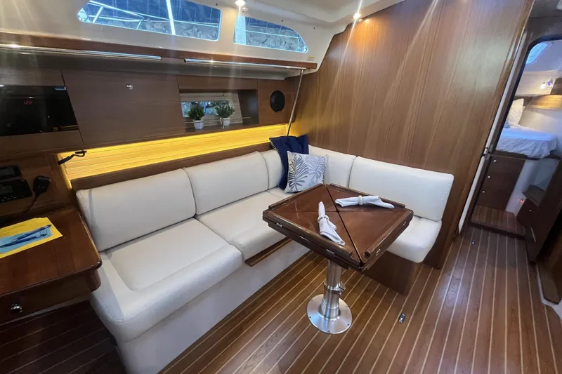 Slide: The Image of Luxurious interior of 2026 Catalina 386 yacht with elegant seating and wooden finishes. - 6