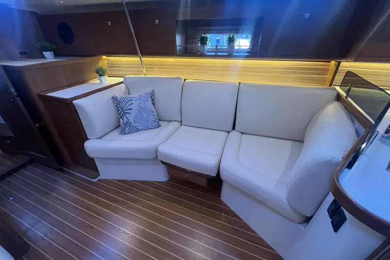 Slide: The Image of Luxurious interior of 2026 Catalina 386 yacht with white seating and decorative plants. - 7