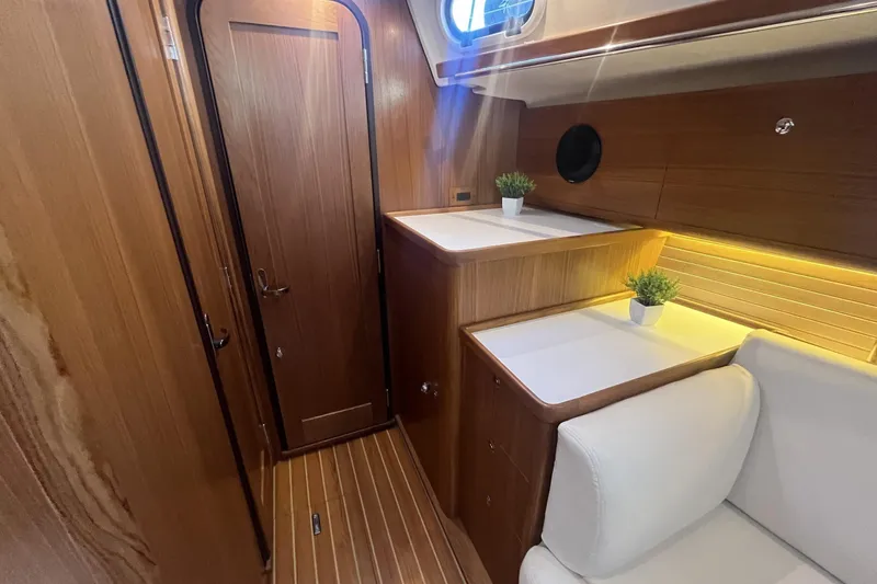 Slide: The Image of Luxurious interior of 2026 Catalina 386 yacht with wood finish and modern lighting. - 9