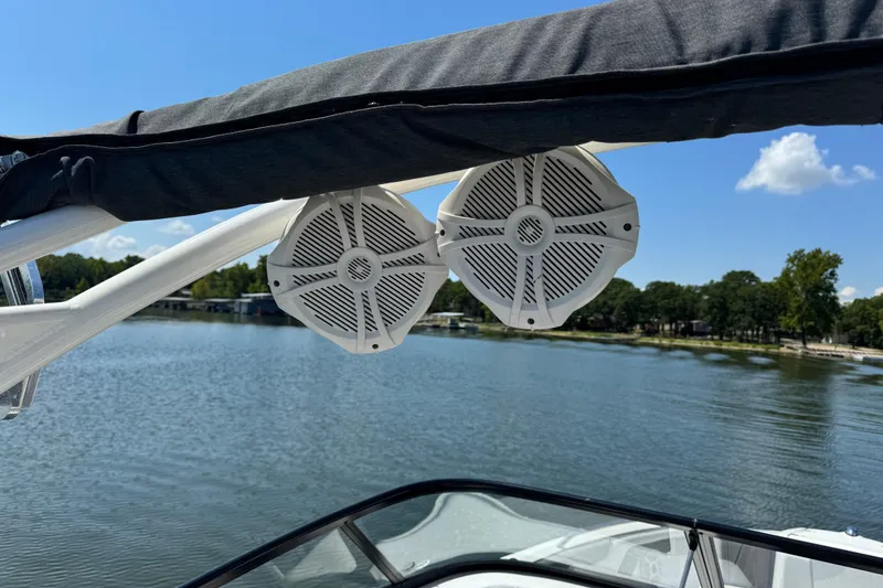 Slide: The Image of 2020 Yamaha AR210 boat speakers with lake view and clear blue sky. - 14