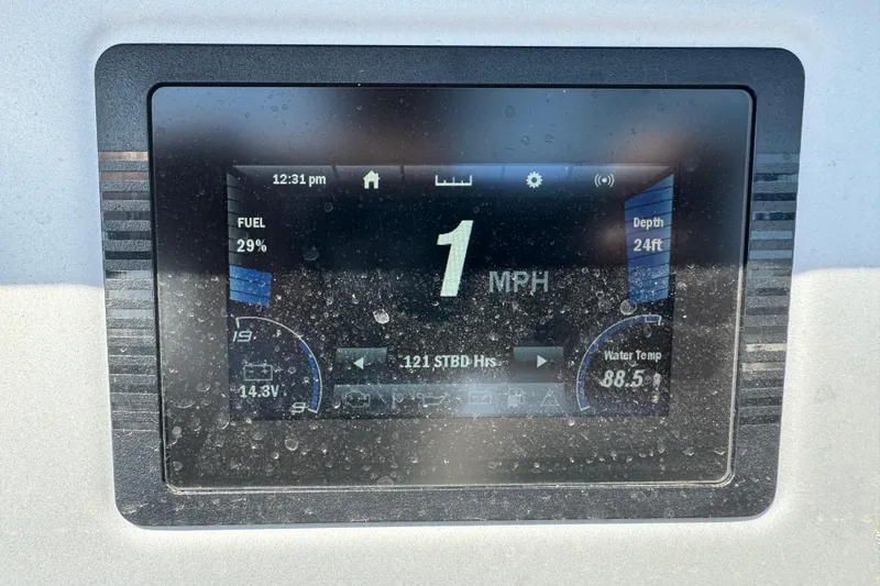 Slide: The Image of Dashboard display of a 2020 Yamaha AR210 boat showing speed, fuel, and water temperature. - 20
