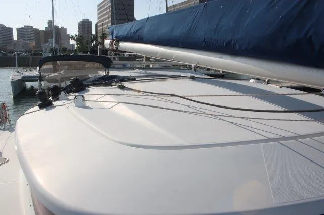 Slide: The Image of 2008 Fountaine Pajot Orana 44 catamaran deck with city skyline in background. - 10