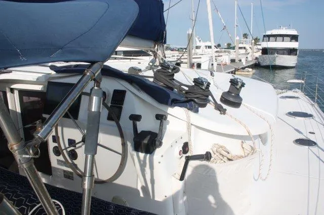 Slide: The Image of 2008 Fountaine Pajot Orana 44 catamaran docked at a marina. - 11