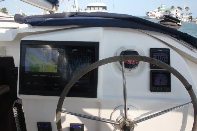 Slide: The Image of Helm of 2008 Fountaine Pajot Orana 44 catamaran with navigation instruments. - 12