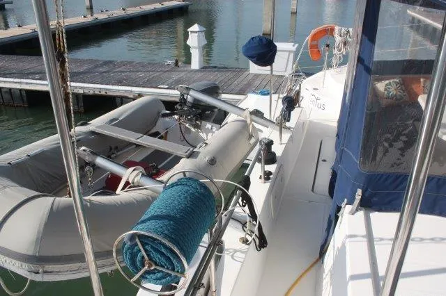 Slide: The Image of 2008 Fountaine Pajot Orana 44 catamaran with dinghy at marina dock. - 17