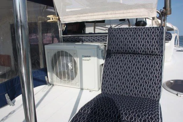 Slide: The Image of 2008 Fountaine Pajot Orana 44 yacht deck with air conditioning unit and patterned seating. - 18