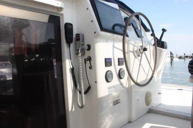 Slide: The Image of Helm station of 2008 Fountaine Pajot Orana 44 catamaran with steering wheel and navigation instruments. - 21