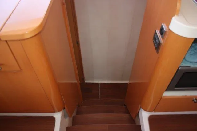 Slide: The Image of Interior stairs of 2008 Fountaine Pajot Orana 44 catamaran with wooden finish. - 30