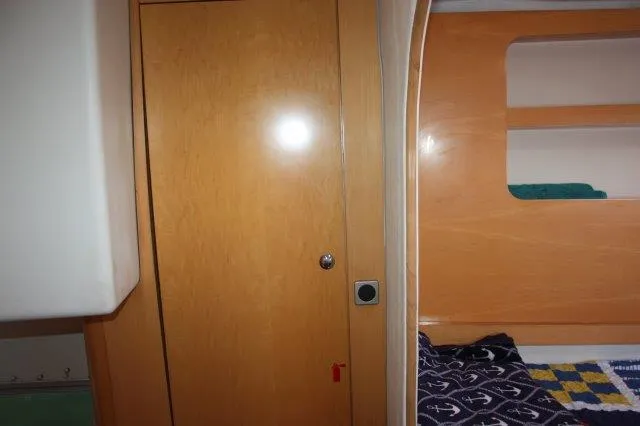 Slide: The Image of Interior cabin of 2008 Fountaine Pajot Orana 44 catamaran with wooden door and bed. - 33