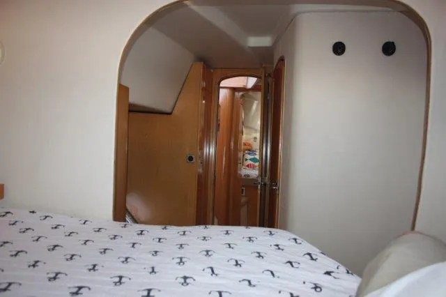 Slide: The Image of Interior cabin of 2008 Fountaine Pajot Orana 44 catamaran with anchor-patterned bedding. - 47
