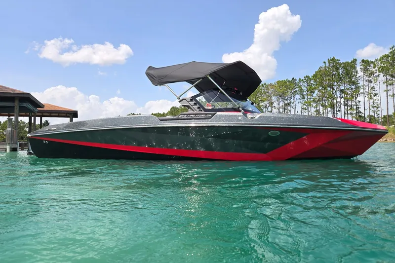 Slide: The Image of 2025 Nautique Ski Nautique boat on clear water, featuring sleek design and vibrant colors. - 6