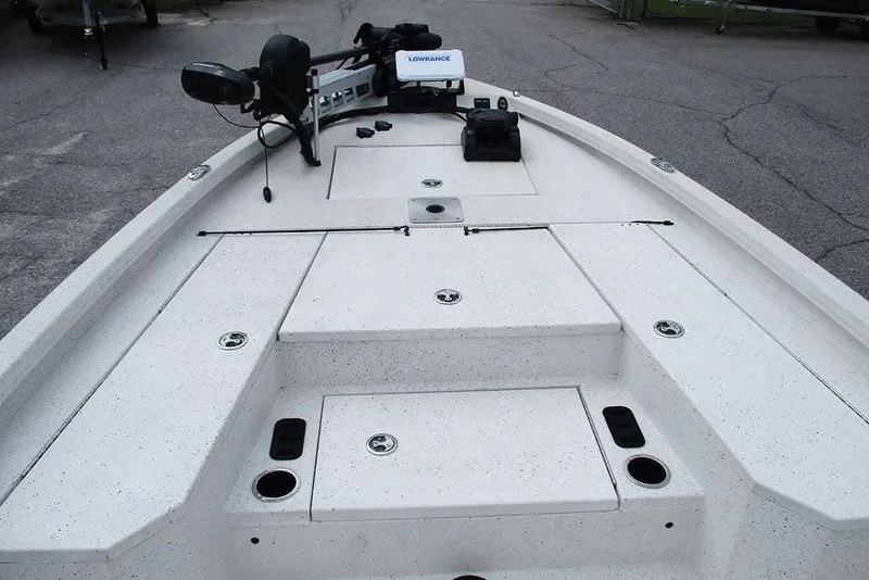 Slide: The Image of 2023 Vexus AVX2180CC boat deck with storage compartments and fishing equipment. - 10