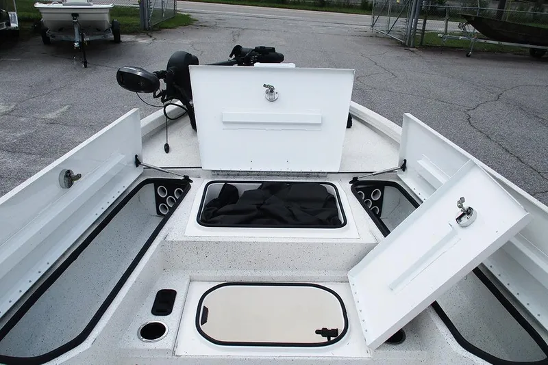 Slide: The Image of 2023 Vexus AVX2180CC boat storage compartments open, showcasing spacious interior design. - 13