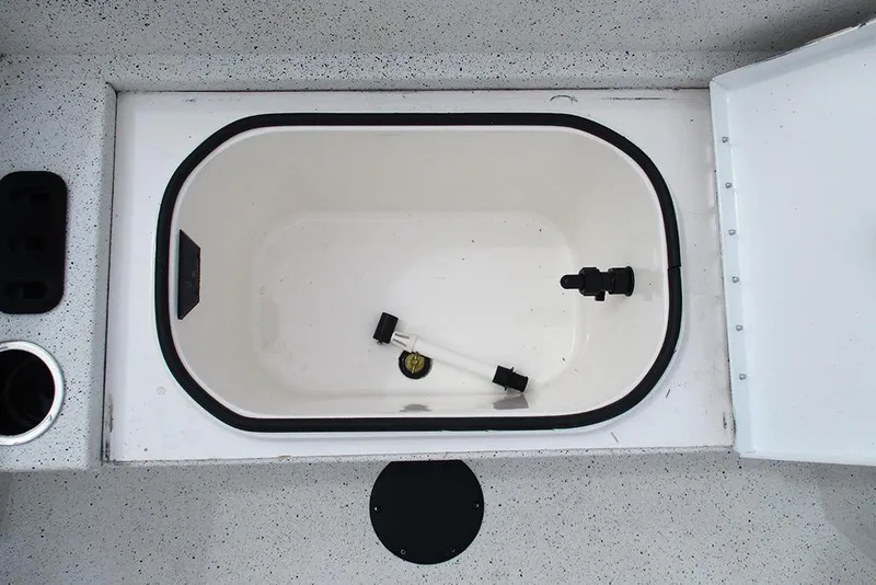 Slide: The Image of 2023 Vexus AVX2180CC boat livewell with white interior and black fittings. - 15