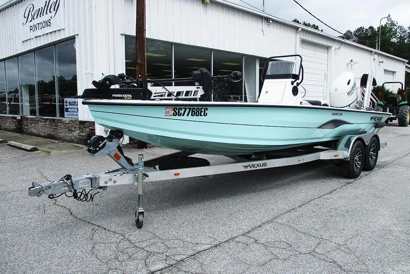 Slide: The Image of 2023 Vexus AVX2180CC boat on trailer outside Bentley Pontoons dealership. - 2