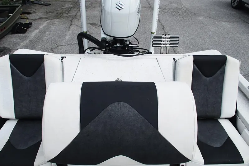 Slide: The Image of 2023 Vexus AVX2180CC boat interior with black and white seating. - 21