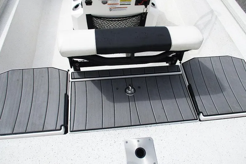 Slide: The Image of 2023 Vexus AVX2180CC boat interior with cushioned seating and deck storage. - 22