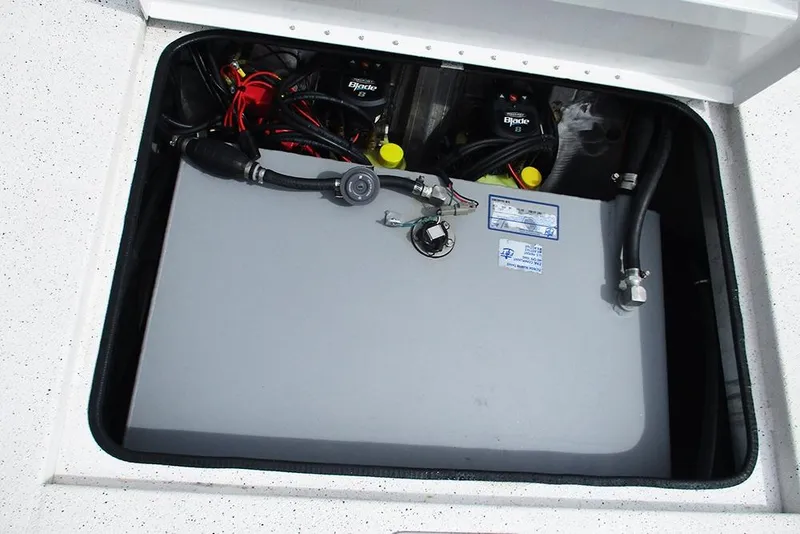 Slide: The Image of 2023 Vexus AVX2180CC boat battery compartment with wiring and components. - 27