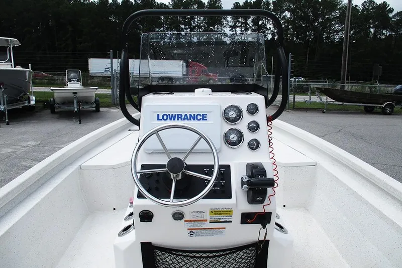 Slide: The Image of 2023 Vexus AVX2180CC boat console with steering wheel and Lowrance electronics. - 28