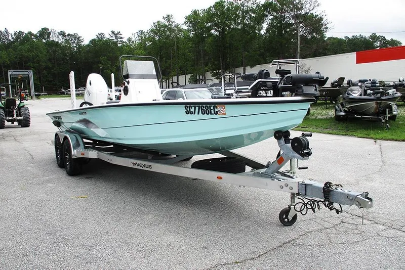 Slide: The Image of 2023 Vexus AVX2180CC boat on trailer in outdoor setting. - 5
