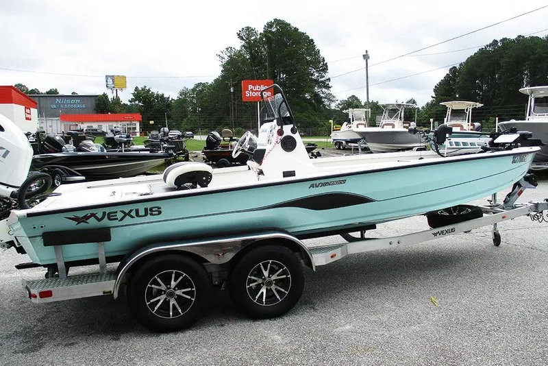 Slide: The Image of 2023 Vexus AVX2180CC boat on trailer in outdoor dealership lot. - 6