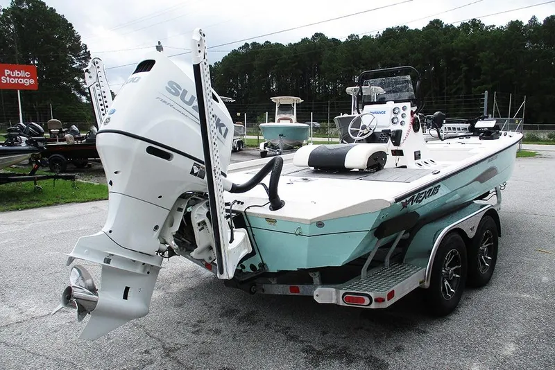 Slide: The Image of 2023 Vexus AVX2180CC boat with Suzuki outboard motor on a trailer. - 7