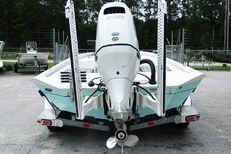 Slide: The Image of 2023 Vexus AVX2180CC boat on trailer, rear view with outboard motor. - 8