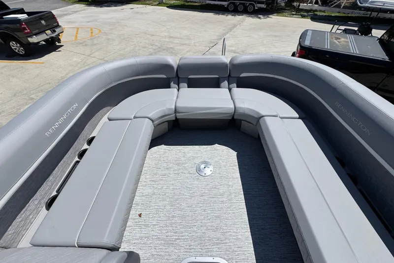 Slide: The Image of 2026 Bennington 24 MSB pontoon boat with spacious gray seating area. - 19
