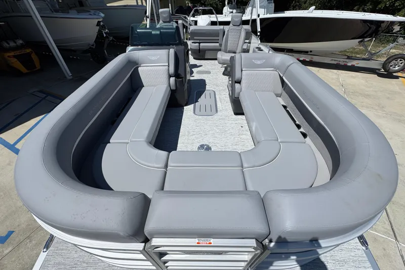Slide: The Image of 2026 Bennington 24 MSB pontoon boat with spacious gray seating and modern design. - 20