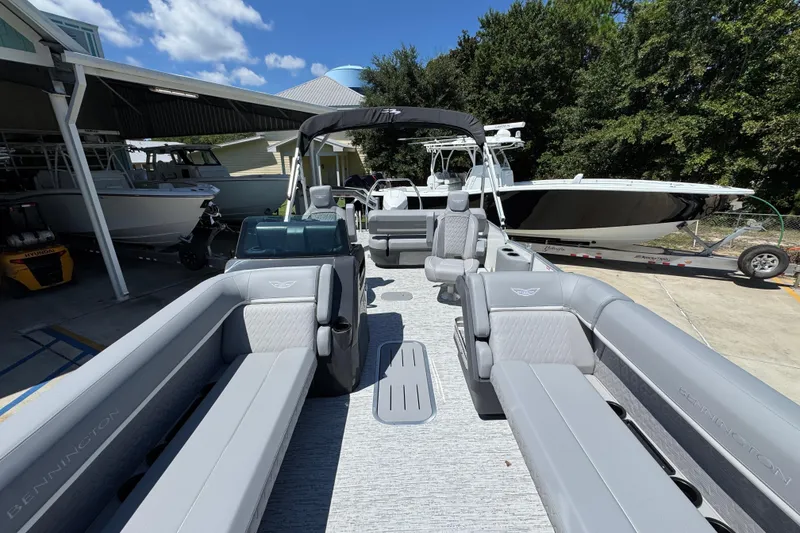 Slide: The Image of 2026 Bennington 24 MSB pontoon boat with luxurious seating and sleek design. - 21