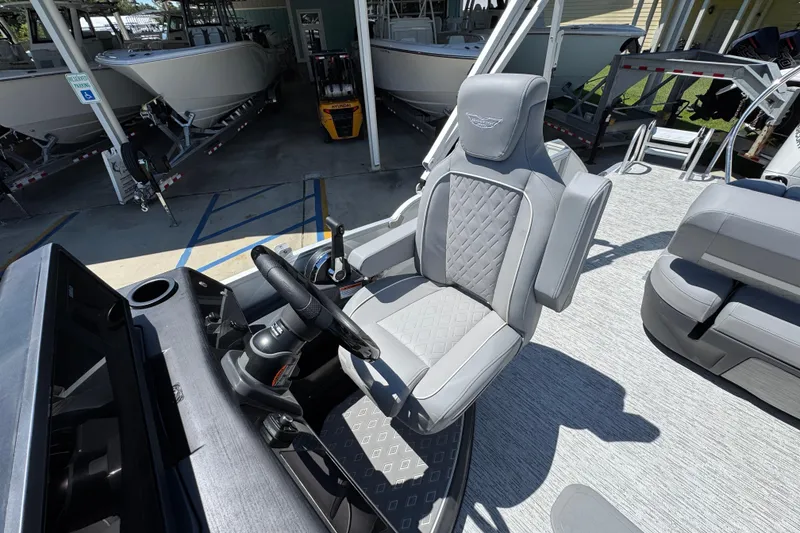 Slide: The Image of Captain's seat of 2026 Bennington 24 MSB boat, featuring luxurious gray upholstery. - 27