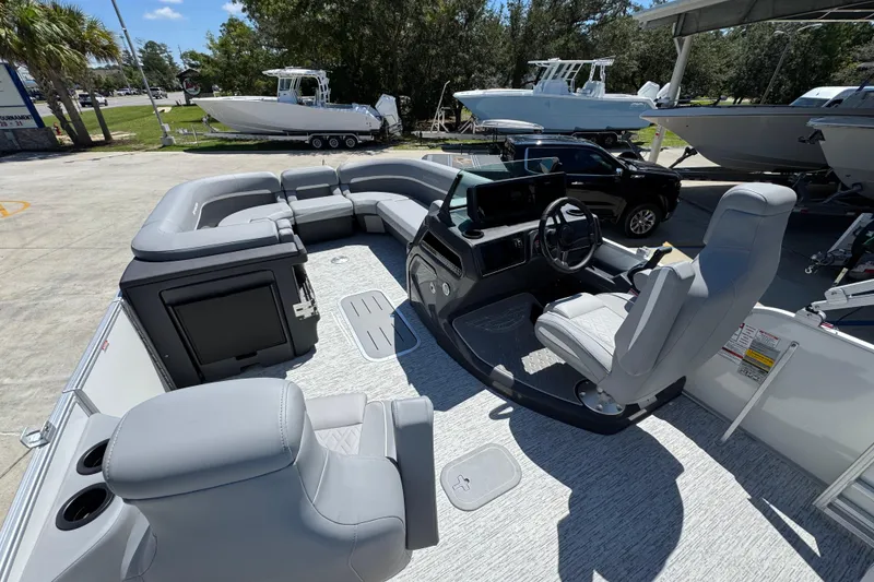 Slide: The Image of 2026 Bennington 24 MSB pontoon boat interior with plush seating and modern helm. - 30