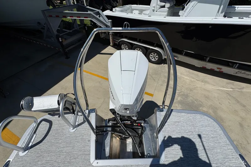 Slide: The Image of 2026 Bennington 24 MSB boat with outboard motor and stainless steel railing. - 36