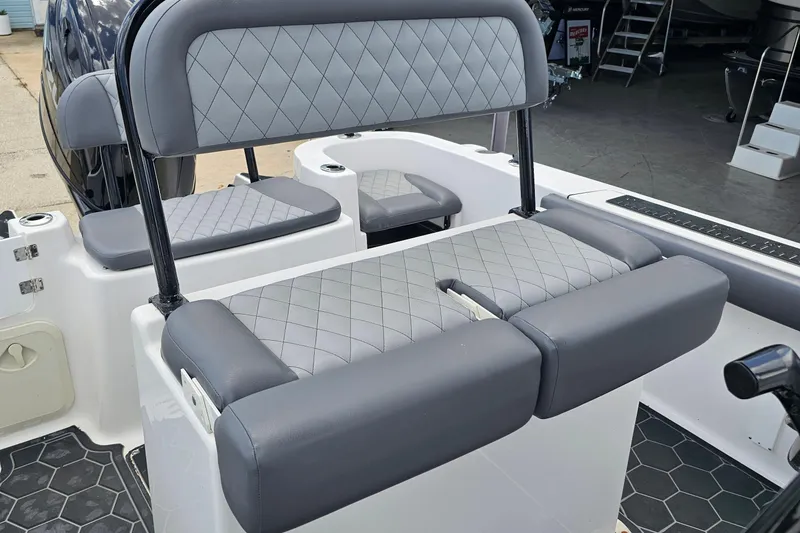 Slide: The Image of 2024 Polar 220CC boat interior with gray diamond-stitched seating and modern design. - 4