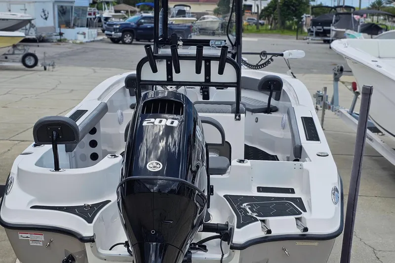 Slide: The Image of 2024 Polar 220CC boat with powerful 200 engine, docked at marina. - 7