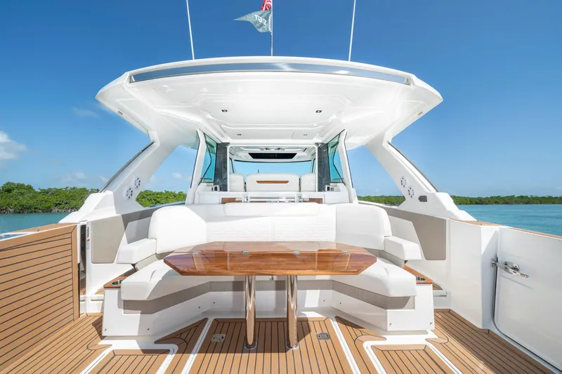 Slide: The Image of Manufacturer Provided Image: 2023 Tiara Yachts 48 LS luxury yacht with spacious seating and elegant wooden table. - 15
