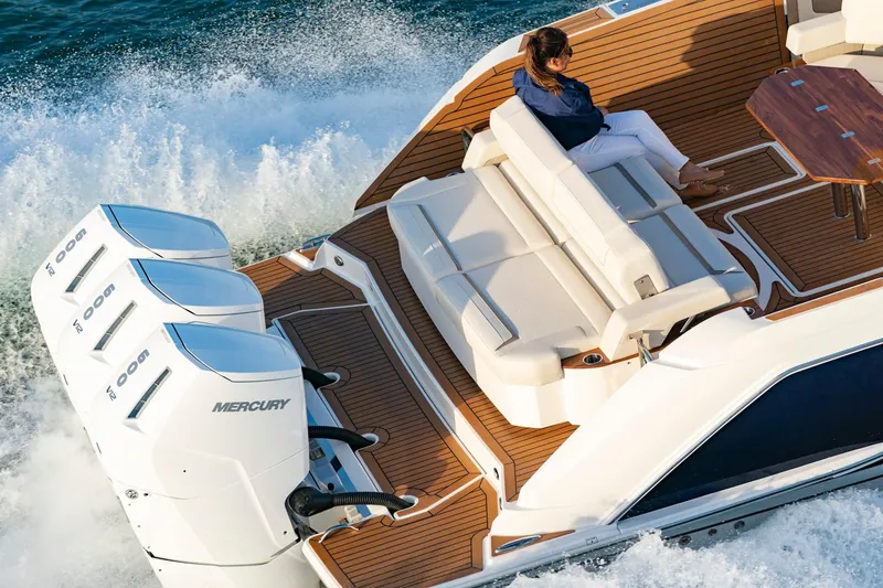 Slide: The Image of Manufacturer Provided Image: 2023 Tiara Yachts 48 LS with triple Mercury outboard engines cruising. - 7