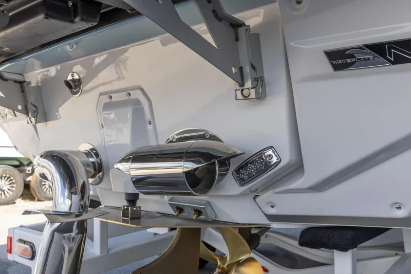 Slide: The Image of 2026 Nautique Super Air Nautique G23 boat stern with propeller and exhaust system. - 30
