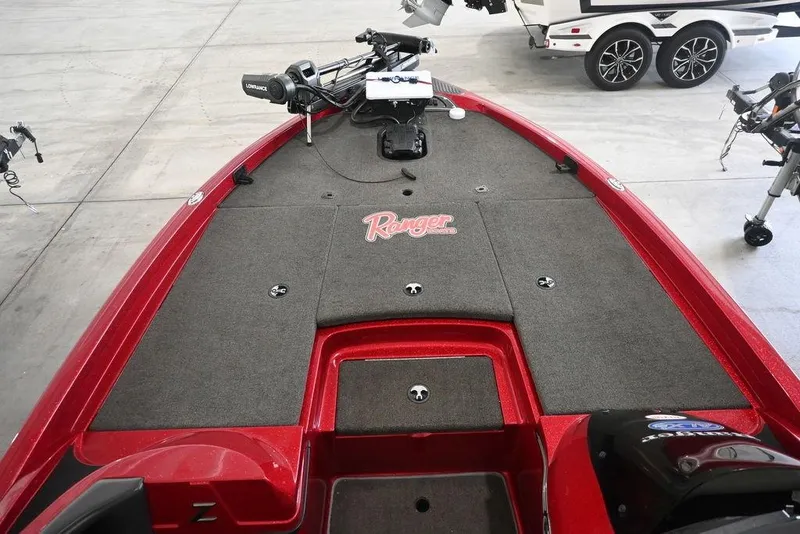 Slide: The Image of 2013 Ranger Z100 Z119 boat interior with red and gray design, featuring a Lowrance system. - 10