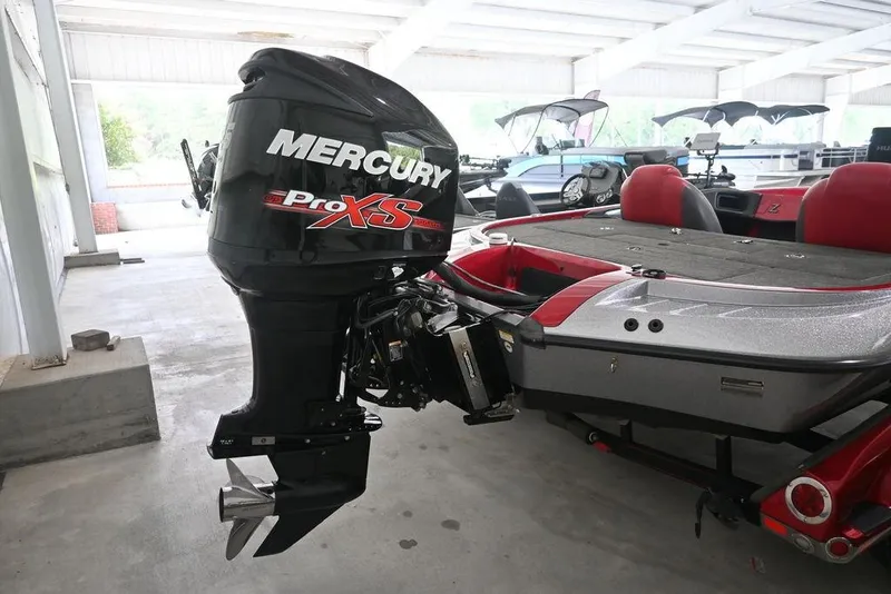 Slide: The Image of 2013 Ranger Z100 Z119 boat with Mercury Pro XS outboard motor in a covered area. - 3