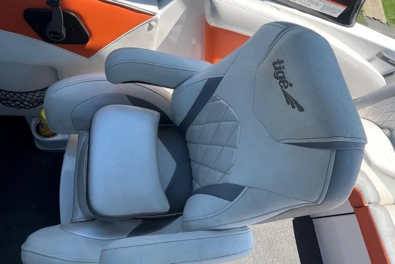 Slide: The Image of 2015 Tigé RZ 2 boat seat with gray upholstery and logo detailing. - 11