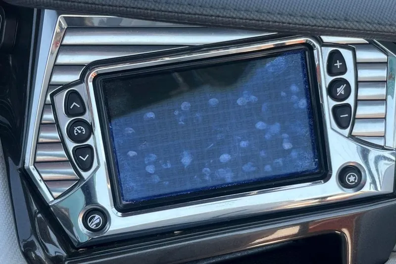 Slide: The Image of Touchscreen control panel in a 2015 Tigé RZ 2 boat, showing fingerprints. - 15