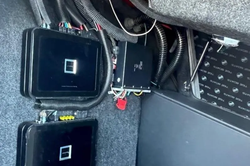 Slide: The Image of Electrical components and wiring inside a 2015 Tigé RZ 2 boat. - 21