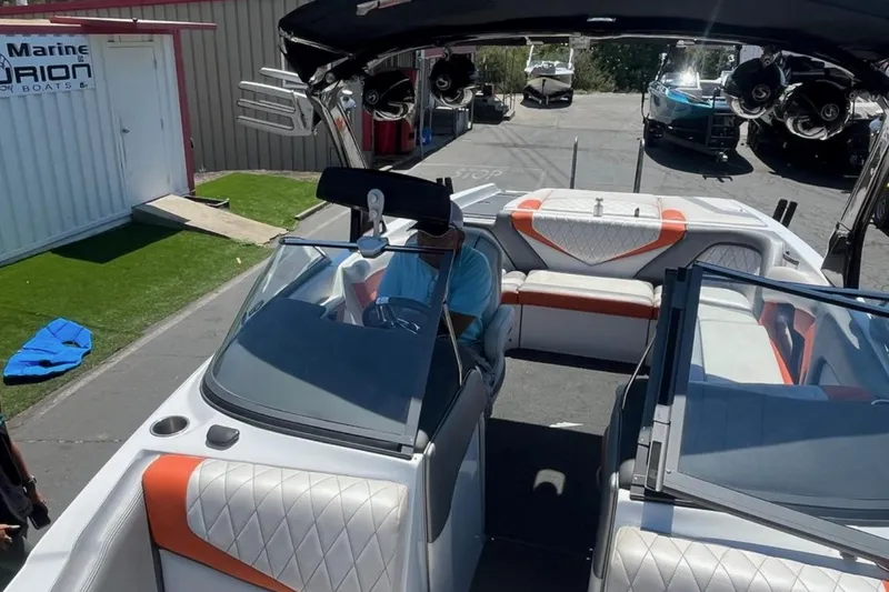 Slide: The Image of 2015 Tigé RZ 2 boat interior with modern seating and dashboard. - 29