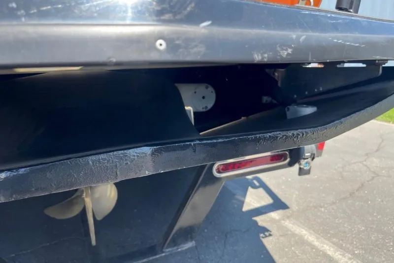 Slide: The Image of 2015 Tigé RZ 2 boat propeller and rear view on pavement. - 3