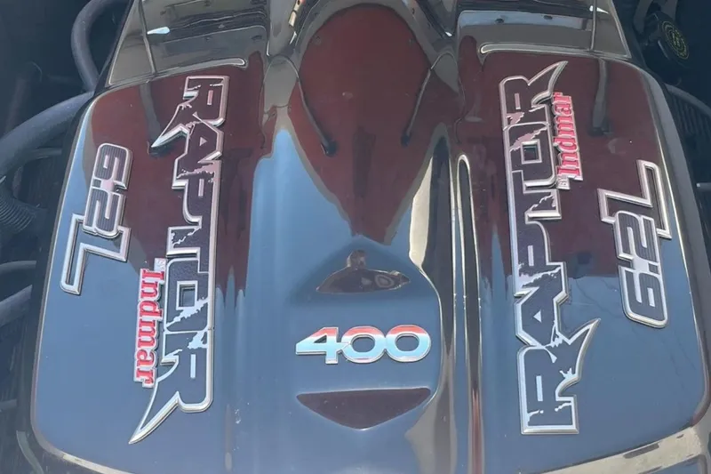 Slide: The Image of Engine cover of a 2015 Tigé RZ 2 with Indmar Raptor 6.2L branding. - 7