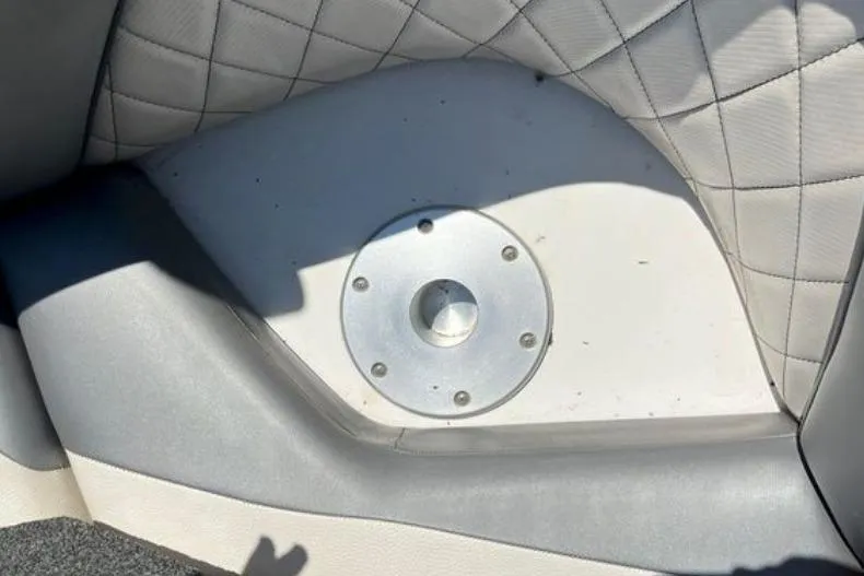 Slide: The Image of 2015 Tigé RZ 2 boat interior with quilted upholstery and metal fixture. - 9