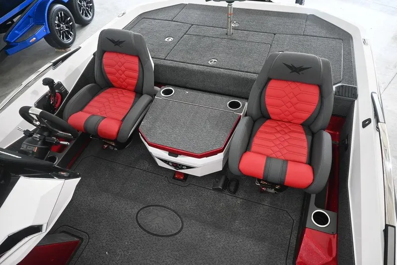 Slide: The Image of 2026 Vexus VX s21 boat interior with red and gray seats, steering wheel, and storage compartments. - 11