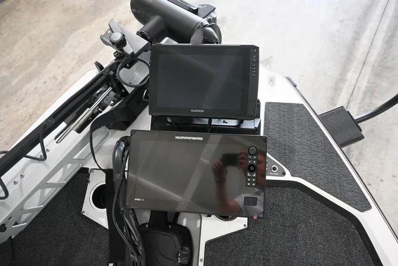 Slide: The Image of 2026 Vexus VX s21 boat dashboard with Garmin and Humminbird displays. - 15