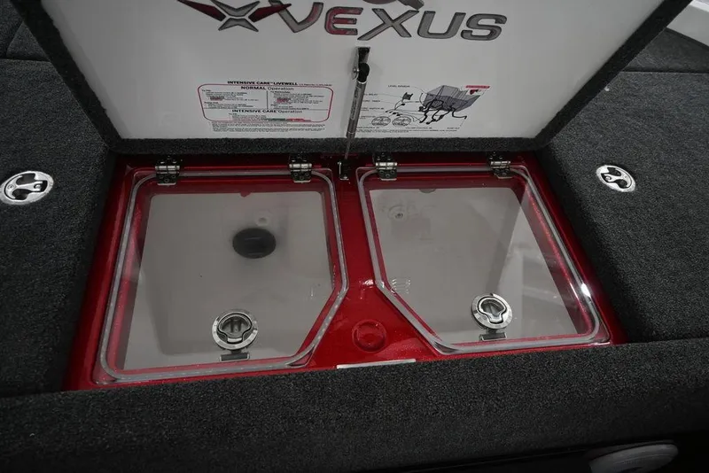 Slide: The Image of 2026 Vexus VX s21 livewell compartment with dual transparent lids and secure latches. - 16